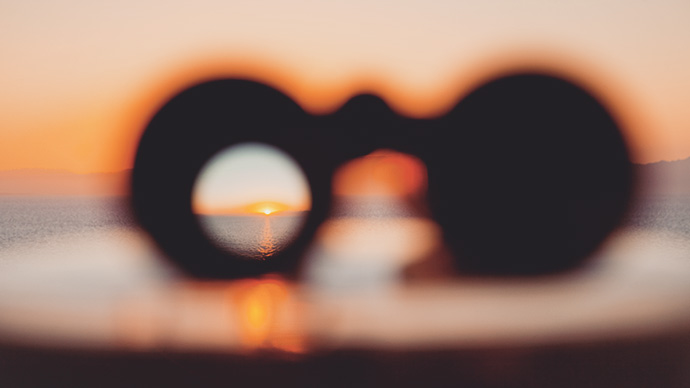 Sunset through binoculars from cruise ship